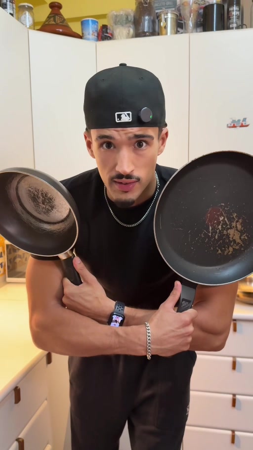 Yûnes comparing cookware in his kitchen